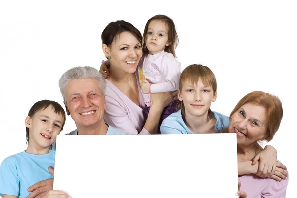 Happy Caucasian family of six holding the paper — Stock Photo, Image