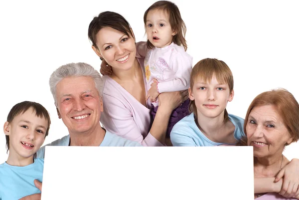 Happy Caucasian family of six holding the paper — Stock Photo, Image