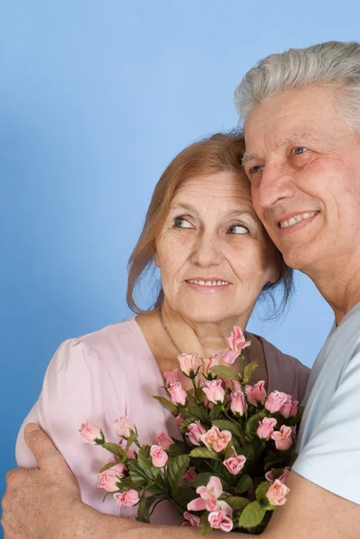 Happy Caucasian elderly stand together with the flower Stock Photo
