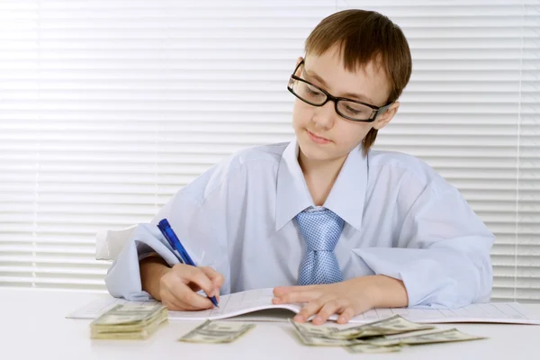 Caucasian young business man logs are sitting at a table — Stock Photo, Image