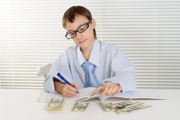 Caucasian young business boy logs are sitting at a table — Stock Photo, Image