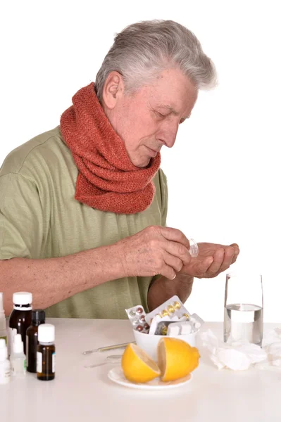 Elderly man treated by medicines — Stock Photo, Image