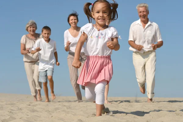 Friendly family running — Stock Photo, Image