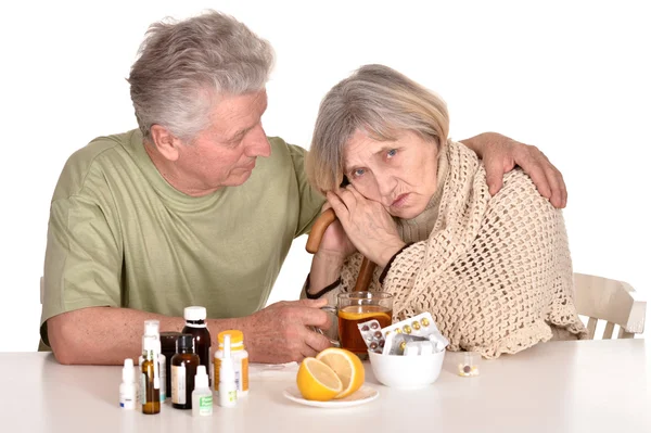 Older man caring for sick woman — Stock Photo, Image