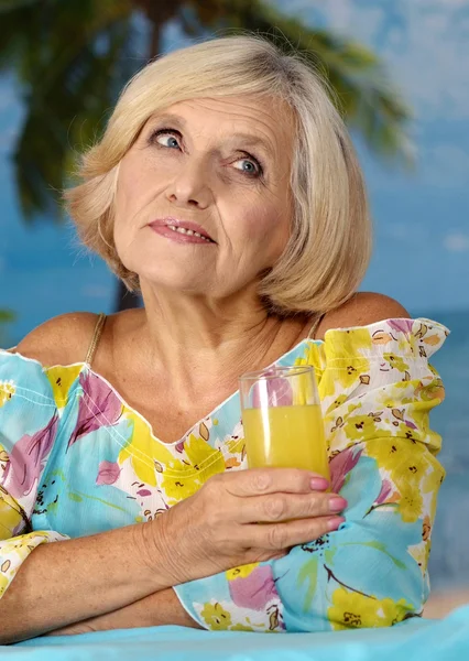 Older woman on vacation in the summer — Stock Photo, Image