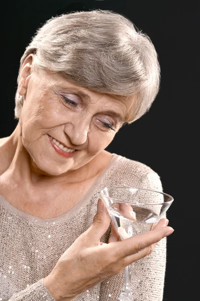 Elderly woman in studio — Stock Photo, Image