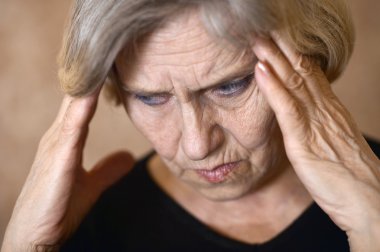 older woman with a headache clipart