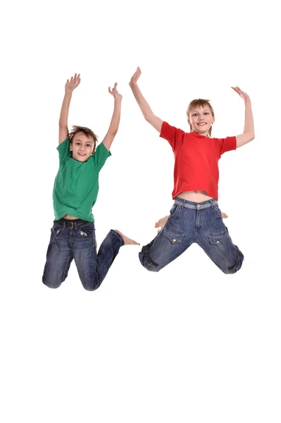 Dois meninos alegres pulando — Fotografia de Stock