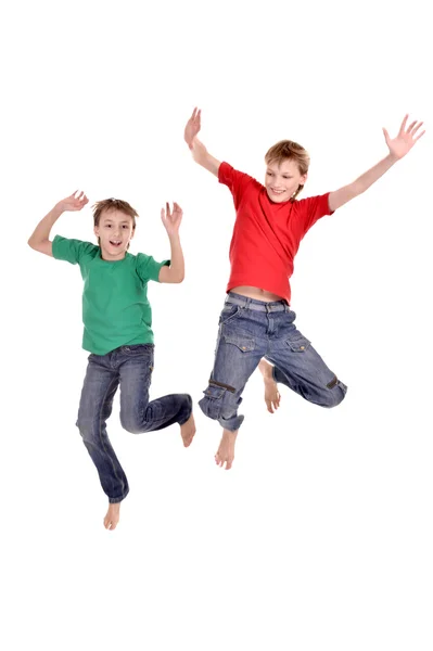 Two cheerful boys jumping — Stock Photo, Image