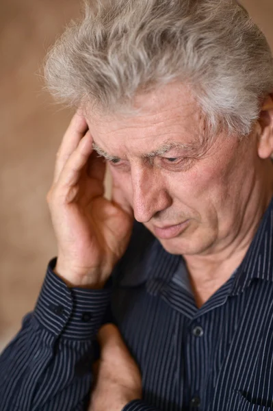 Elderly man with a headache — Stock Photo, Image