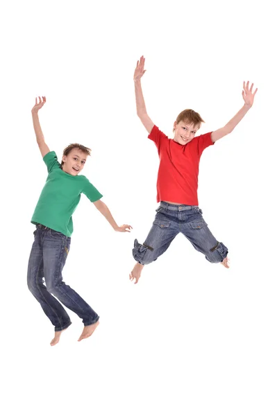 Dois meninos alegres pulando — Fotografia de Stock