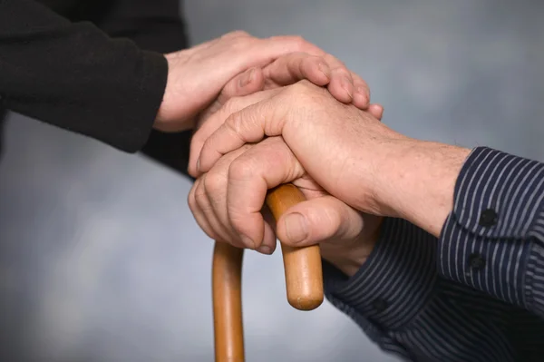 Two hands over gray background — Stock Photo, Image