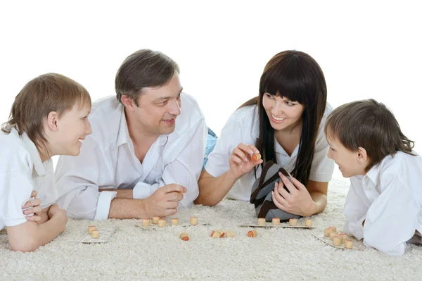 Happy family playing lotto — Stock Photo, Image