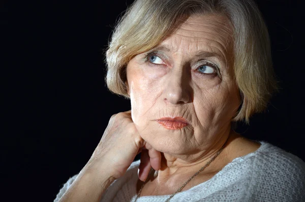 Thoughtful elderly woman — Stock Photo, Image