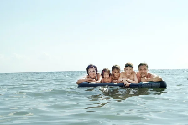 Family on an air mattress — Stock Photo, Image