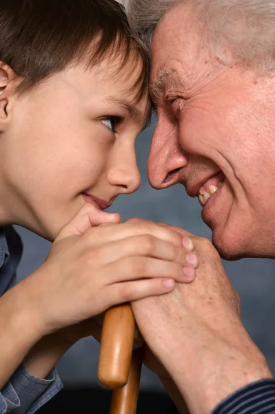 Young boy and his grandfather Stock Image