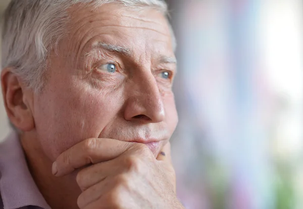 Senior man thinking about something Stock Image