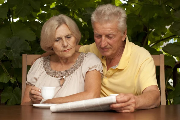 Beautiful older couple sitting on the veranda — Stock Photo, Image