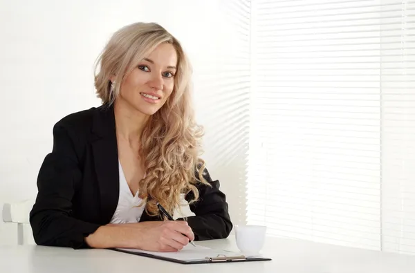 Pretty businesswoman in her office — Stock Photo, Image