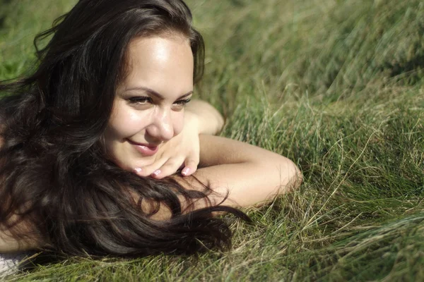 Girl on the grass — стоковое фото