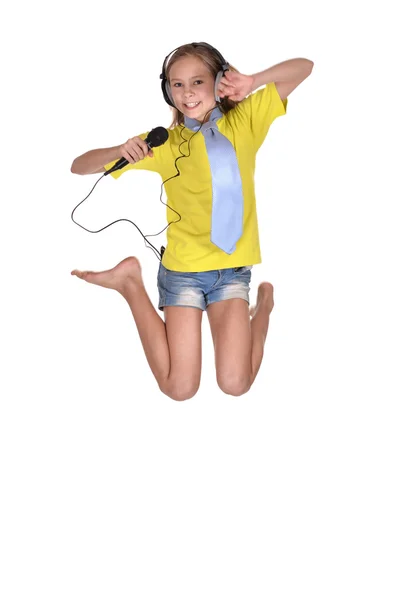 Girl in the yellow shirt singing — Stock Photo, Image