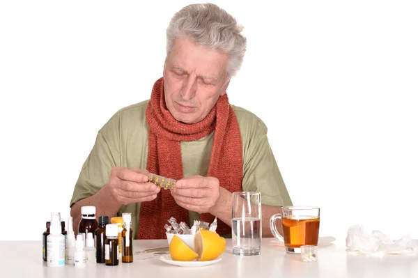 Elderly man treated by medicines — Stock Photo, Image