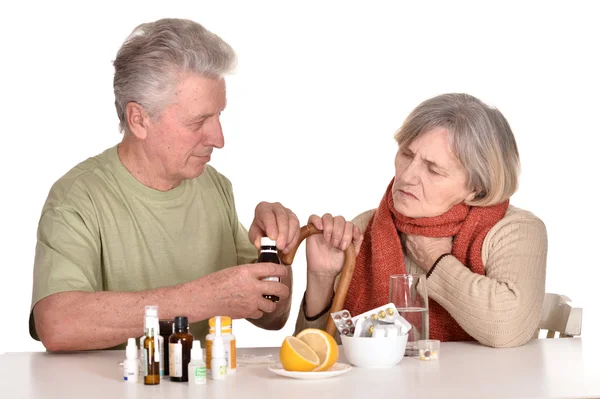 Older man caring for sick woman — Stock Photo, Image