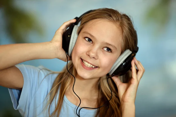 Girl in the blue shirt listening — Stock Photo, Image