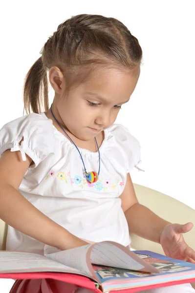 Hermosa chica con un libro sobre blanco — Foto de Stock