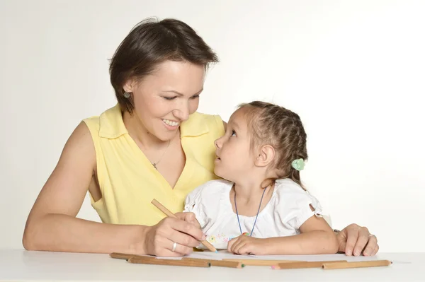 Mother doink homework with her daughter — Stock Photo, Image