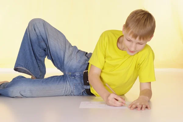 Amusing boy in a yellow T-shirt — Stock Photo, Image