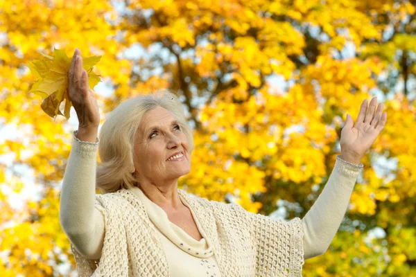 Happy nice woman on a yellow — Stock Photo, Image