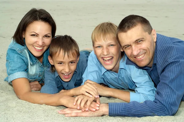 Happy family in blue — Stock Photo, Image