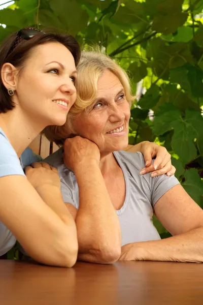 Happy people sitting on the veranda — Stock Photo, Image