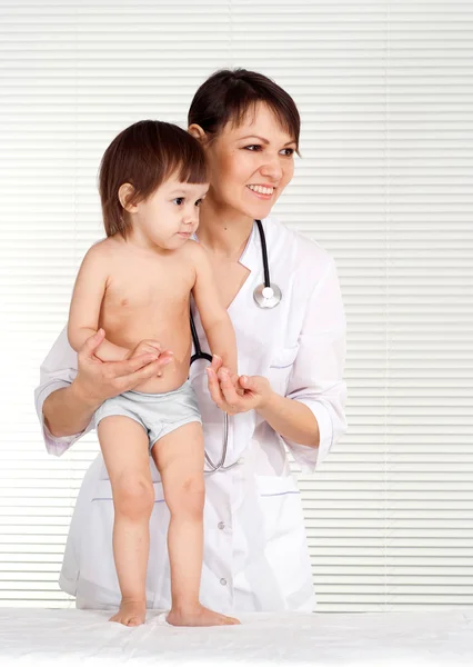 Good-looking physician with small patient Stock Picture