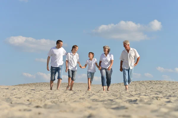 Portrait of a happy family a walking barefoot — Stock Photo, Image