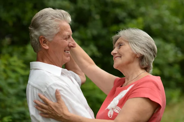 Aged couple dancing outdoors — Stock Photo, Image