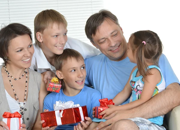 Happy family with gifts Stock Picture