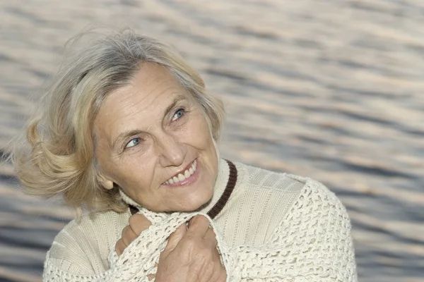 Elderly woman on sea — Stock Photo, Image