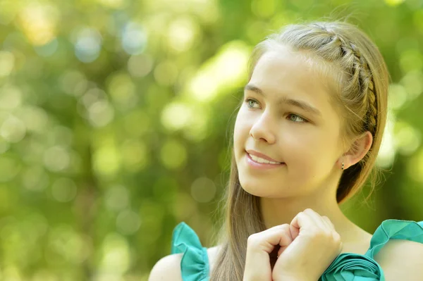 Cute girl in a park — Stock Photo, Image