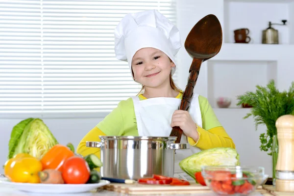 Girl cooking soup — Stock Photo, Image