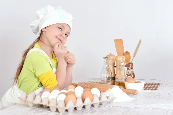 Girl in chef hat and apron — Stock Photo, Image