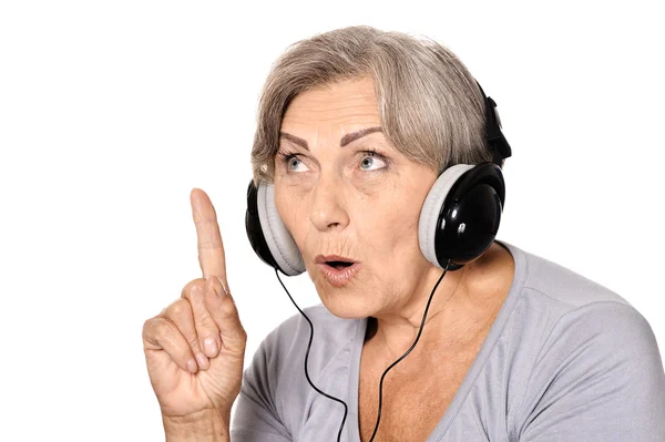 Señora mayor en auriculares —  Fotos de Stock
