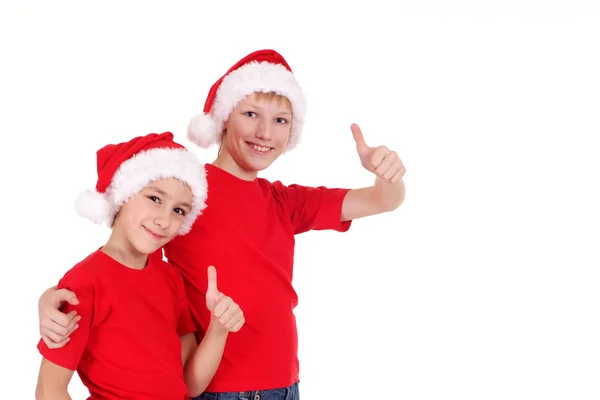 Kleine Brüder mit Weihnachtsmützen — Stockfoto
