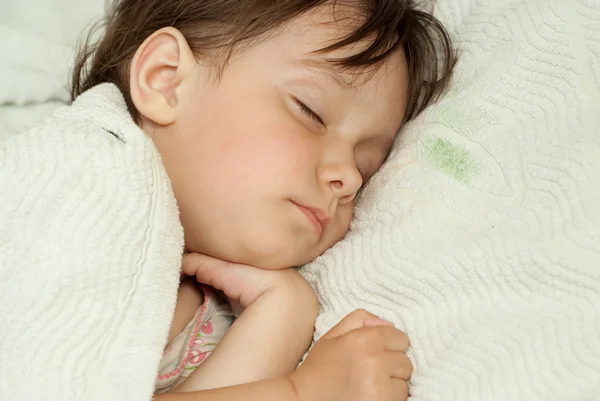 Sympothetic girl lies in bed — Stock Photo, Image