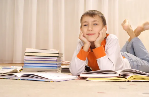 Nice boy does homework — Stock Photo, Image