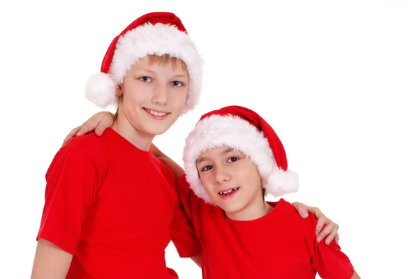 Little brothers in santa hats — Stock Photo, Image