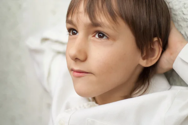 Sweet boy sitting at home — Stock Photo, Image