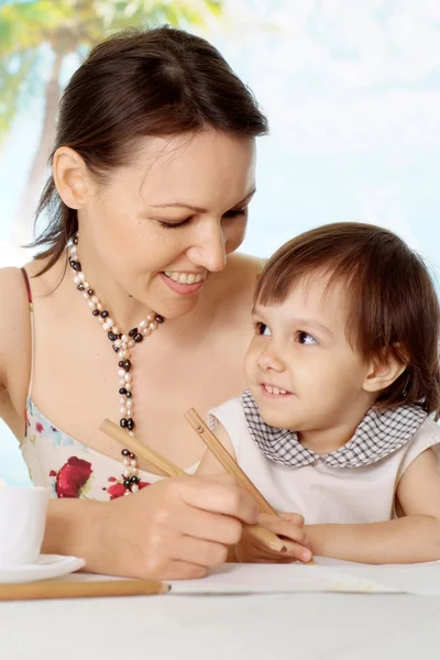 Sweet woman with daughter at the resort — Stock Photo, Image