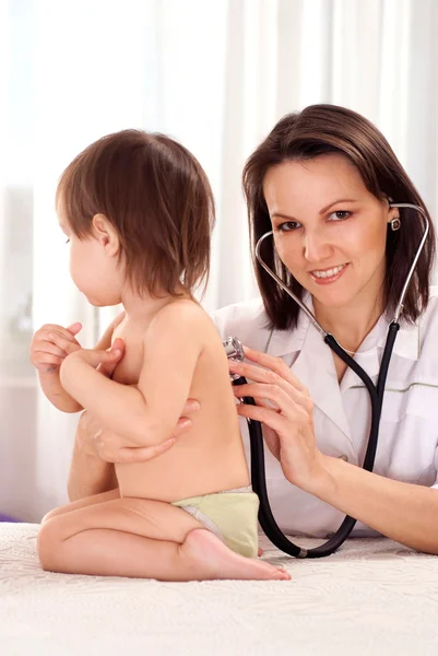Beautiful doctor with small patient — Stock Photo, Image
